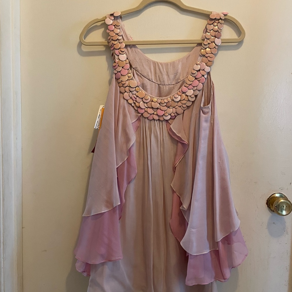 Pink Sleeveless Ruffled Blouse with Embellished Neckline